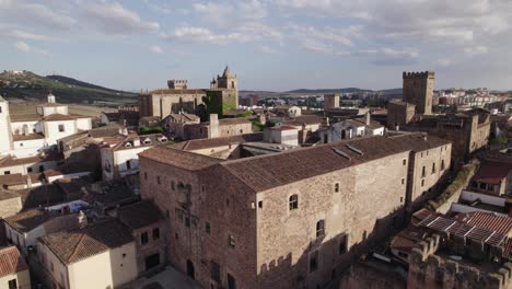 Drone-over-antique-roman-castle-walls-in-Caceres,-Spain-on-a-sunny-summer-day