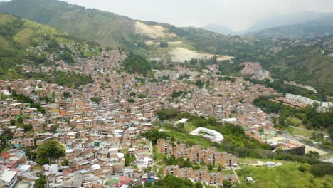 drone rising above comuna 13 slums in medellin, colombia