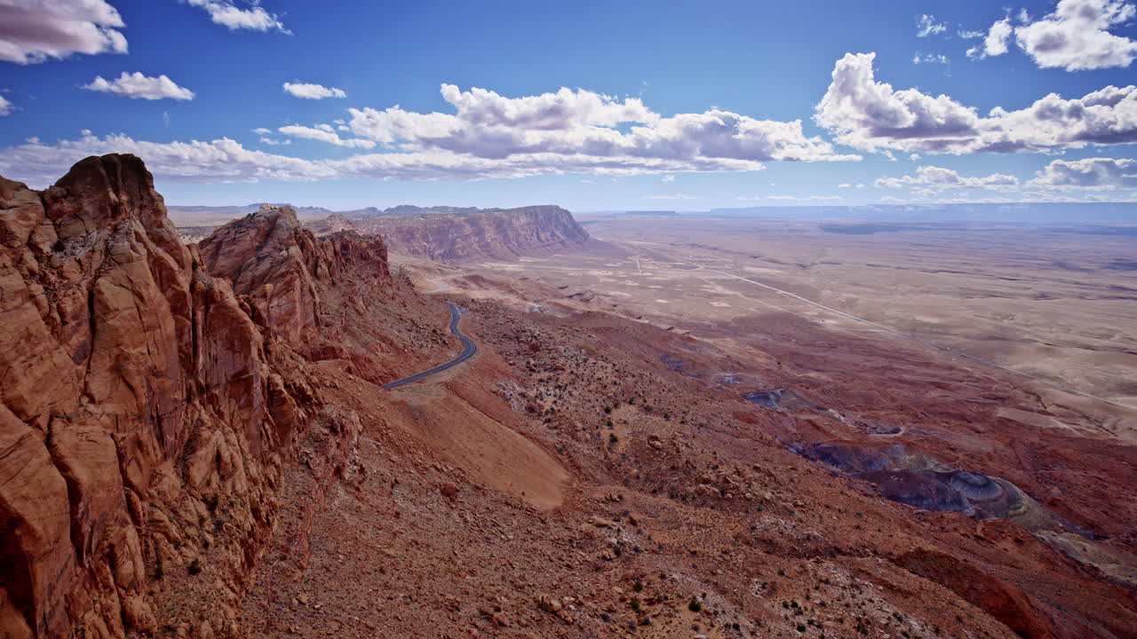 Soaring over Page, Arizona, a drone reveals a surreal pass through the scarlet stone cliffs.