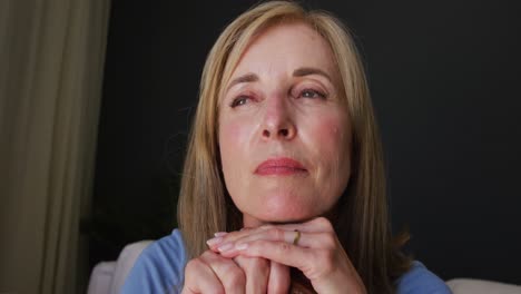 Close-up-of-caucasian-senior-woman-holding-a-walking-stick-at-home