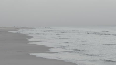 Waves-on-a-Scandinavian-beach-on-a-foggy-day-in-slow-motion