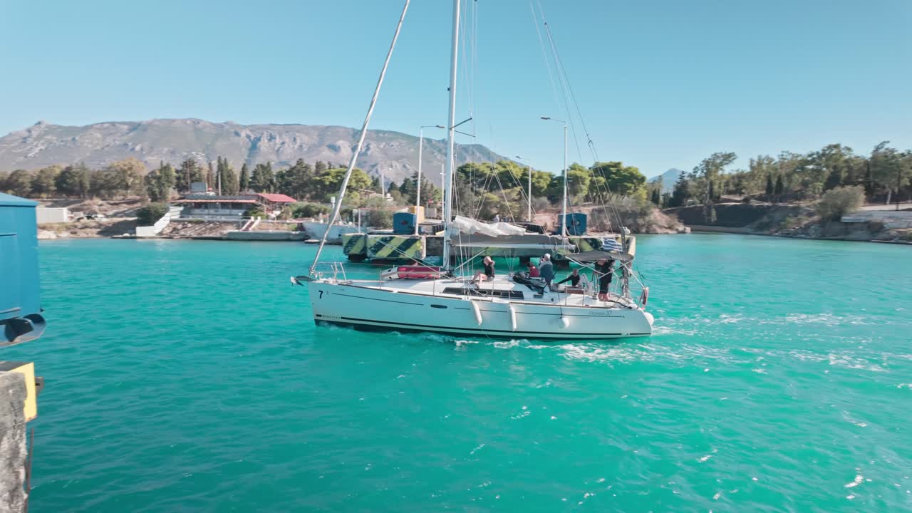 Yacht sails across Corinth canal submersible road bridge