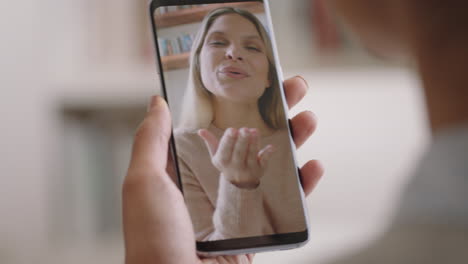 young-woman-having-video-chat-using-smartphone-at-home-chatting-to-friend-enjoying-conversation-sharing-lifestyle-on-mobile-phone-vertical-orientation-4k-footage