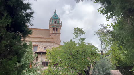 moving frame with a tower in the mountain town of valldemossa, mallorca