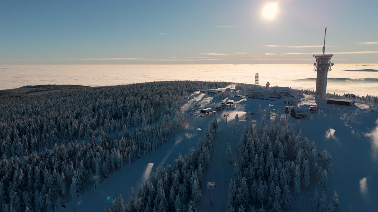 Aerial view of czech ski resort on Klinovec mountain with two slopes and a communications tower