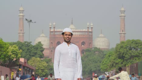 happy indian muslim man standing in front of jama masjid delhi india