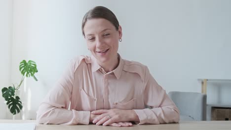 happy vlogger woman looking at camera, enjoying video meeting with friends and colleagues