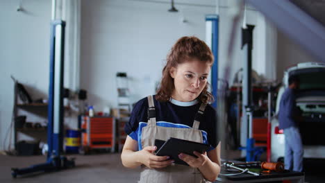 Smiling-engineer-checks-car-performance