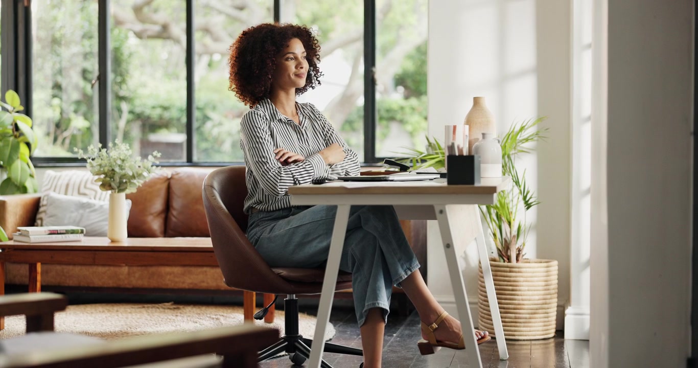 Young Woman Closing Laptop and Thinking at Home Office Desk