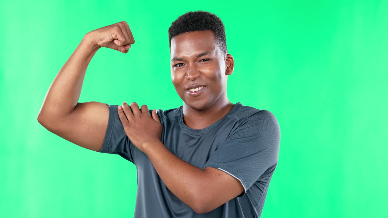 Black man, muscle and strong flexing on green