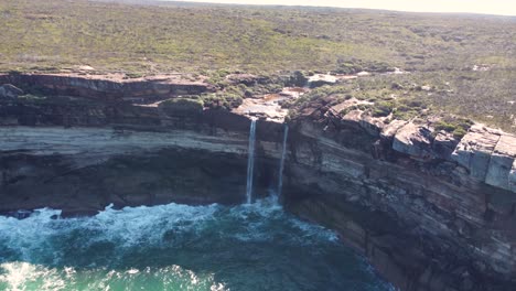 drone aerial landscape shot of royal national park waterfall river system travel tourism nature curracurrong falls sydney nsw australia 4k