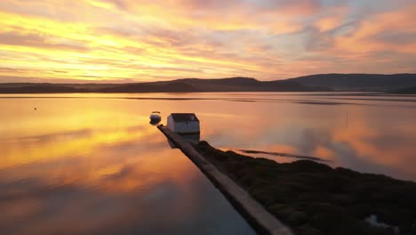 fire sunset over lake in menorca spain