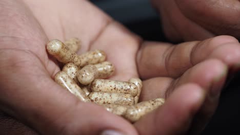 hand holding capsules