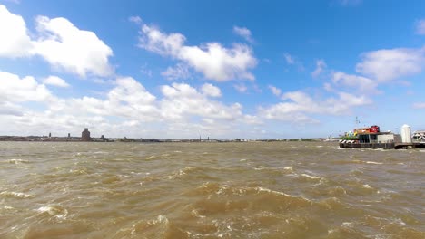 time lapse windy clouds casting shadows over river mersey iconic snowdrop ferry boat liverpool waterfront pier