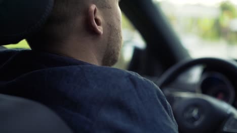 man driving a car