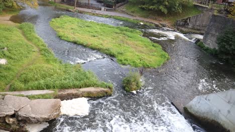 top view of a river flowing through dam