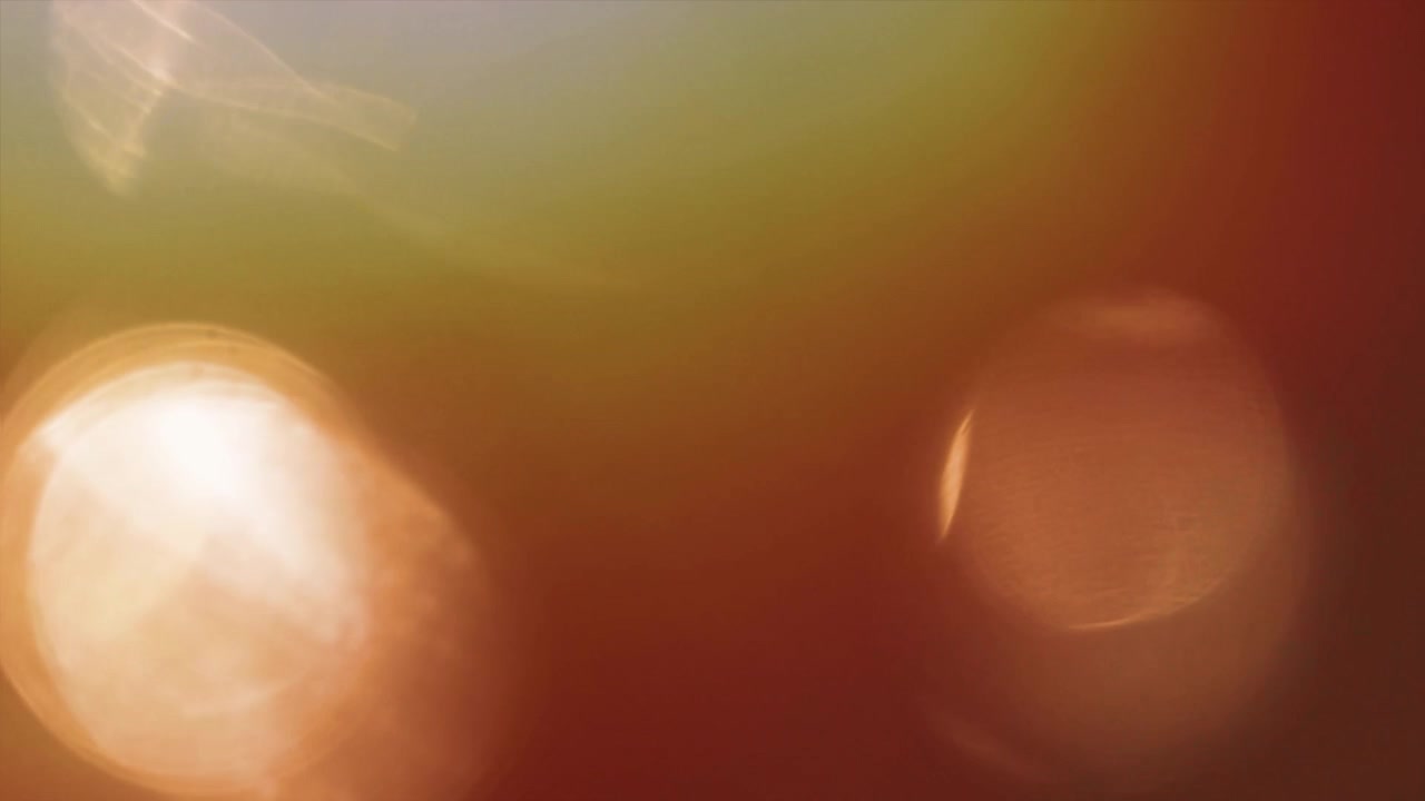 Shifting Warm Bokeh Light Leaks Background