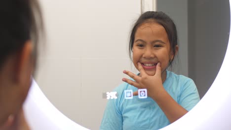 girl smiling after brushing teeth