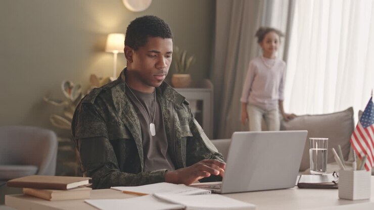 African American Soldier Working on Laptop from Home