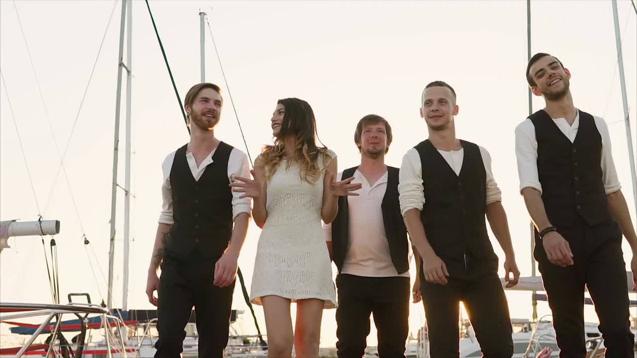 Friends enjoying a sunset walk at the harbor