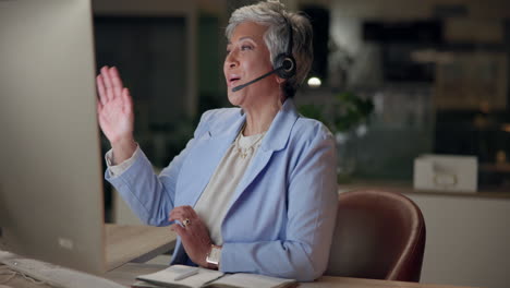 woman working in call center with headset and computer