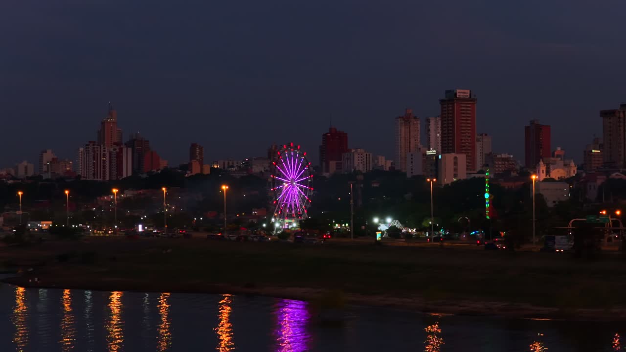 Ecopark - Rueda De La Fortuna, Amusement Park By The Bay At Night In Asuncion, Paraguay. - wide shot