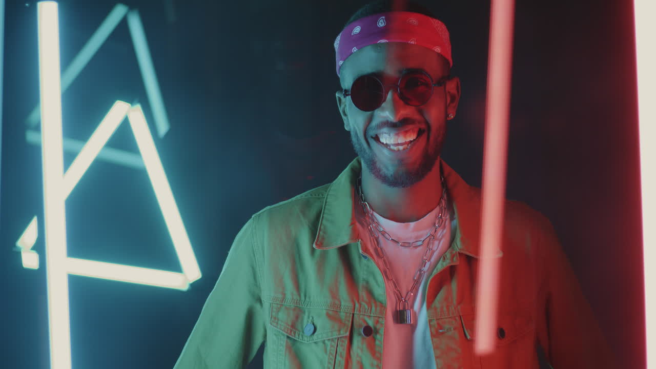 Stylish Man Posing with Neon Lights