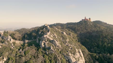 Aerial-rising-shot-revealing-the-Castelo-dos-Mouros-in-the-vast-hillside