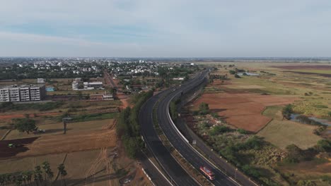 aerial drone shot of highway with vehicles passing through