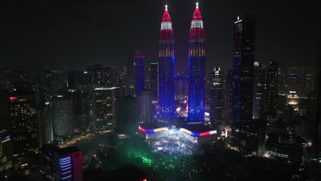 aerial: people celebrating independence day at the petronas twin towers in kl