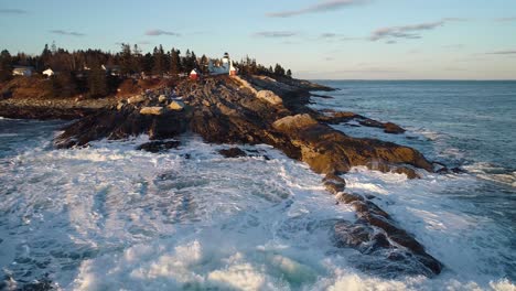 aerial view of the curtis island lighthouse camden maine usa while the waves hits the rocks