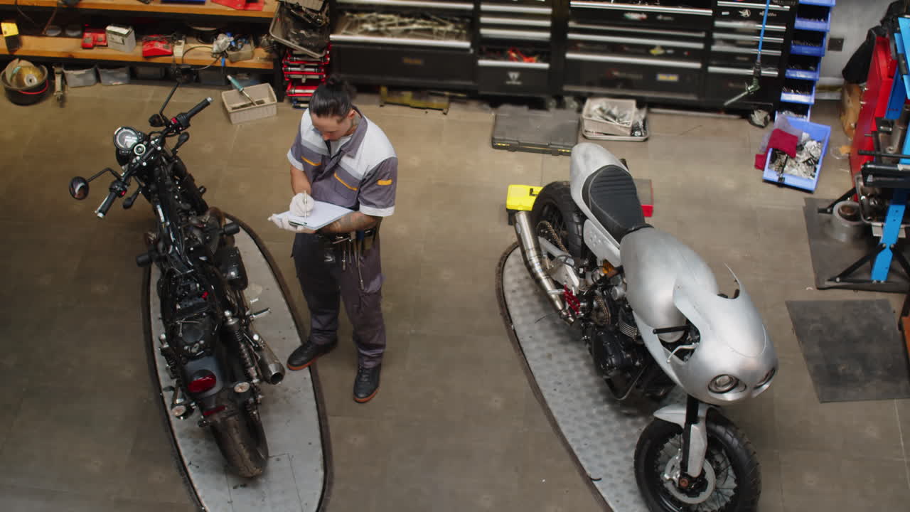 Specialist Working with Motorcycles that Need to Be Fixed