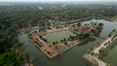 aerial view of ancient temple complex on water island