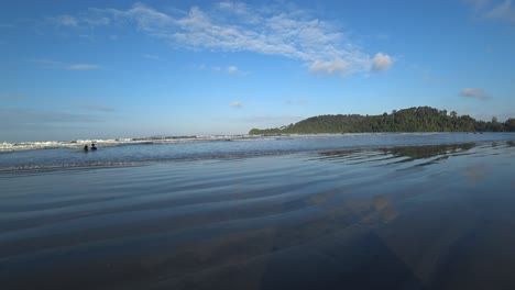 a view of the public beach at teluk gorek beach, mersing, johor, malaysia. a quiet afternoon with fewer visitors