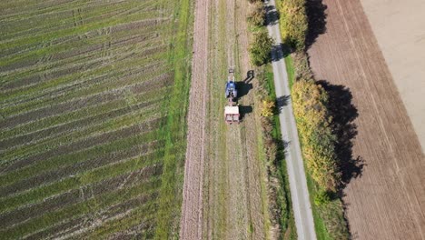 tractor on fall field potato accker and street