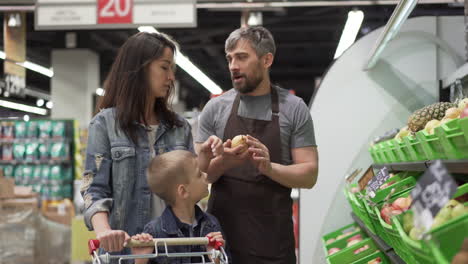 family shopping for fruits at the grocery store