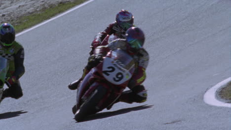 motorcyclists race around a track 1