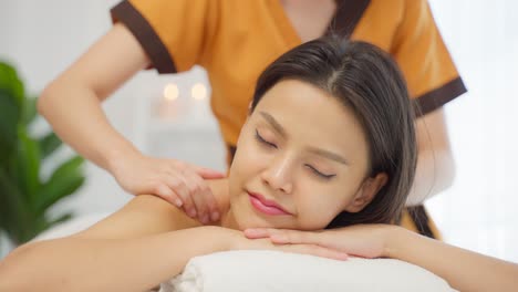 woman receiving a shoulder massage at a spa