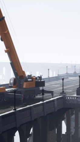 a crane on a bridge in the fog