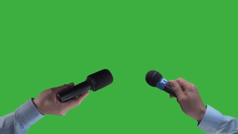 two reporter holding mic, waiting for interview,green screen background