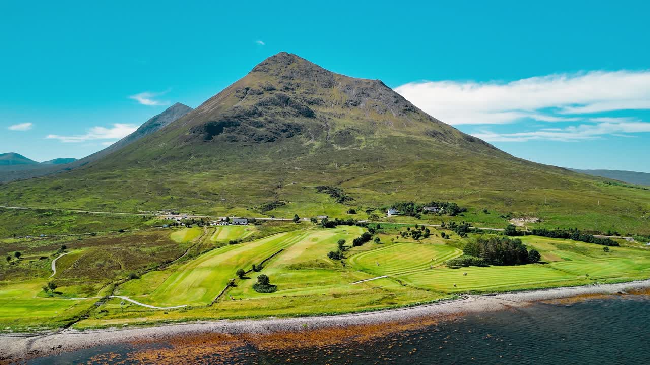 Scenic View of a Golf Course and Mountainous Landscape