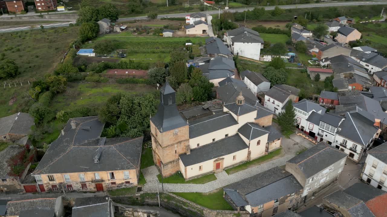 Drone orbit of San Esteban church in A Rúa, Galicia, Spain, showcasing its layout and surroundings