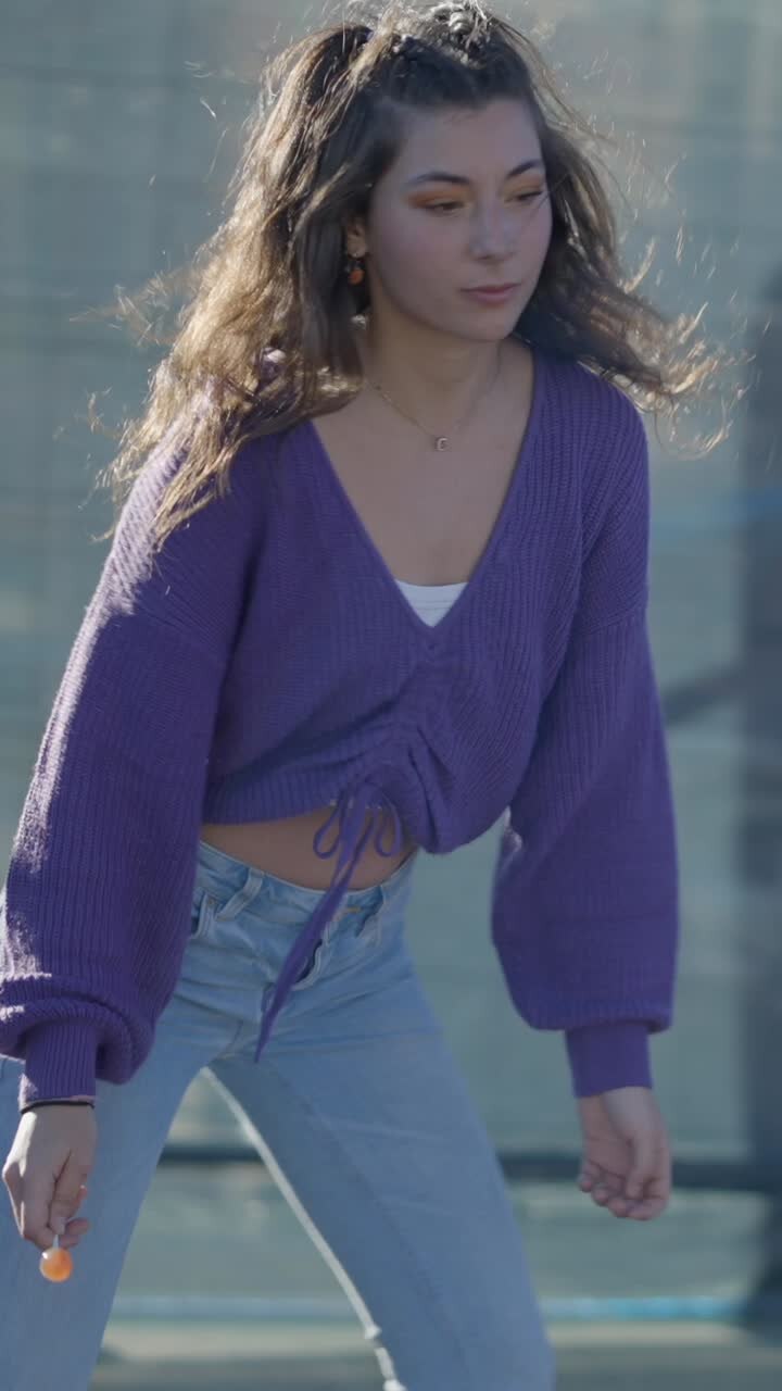Young Woman Holding a Lollipop Outdoors