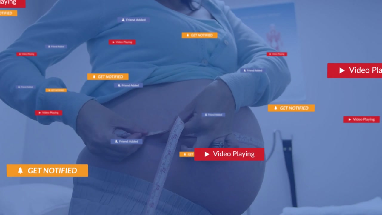 Pregnant patient wrapping tape measure around bump in clinic firing UI overlays tracking accuracy