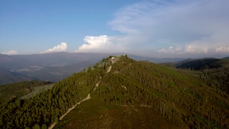 4k aerial flying over a mountain top