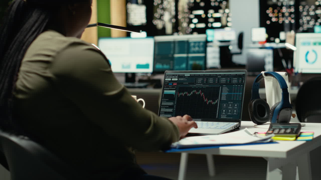 African american analyst monitoring data on stock and forex trading