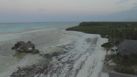 aerial shot of a beach village in zanzibar, tanzania