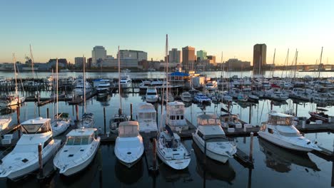 boats in holiday harbor across from norfolk skyline