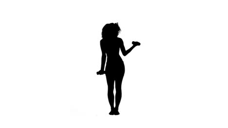 Silhouette-of-an-energetic-woman-lifting-weights