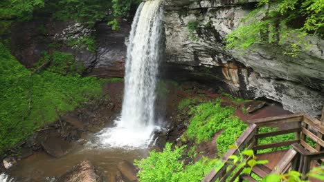 aerial view of female on wooden stairways approaching falls of hills creek, west virginia usa